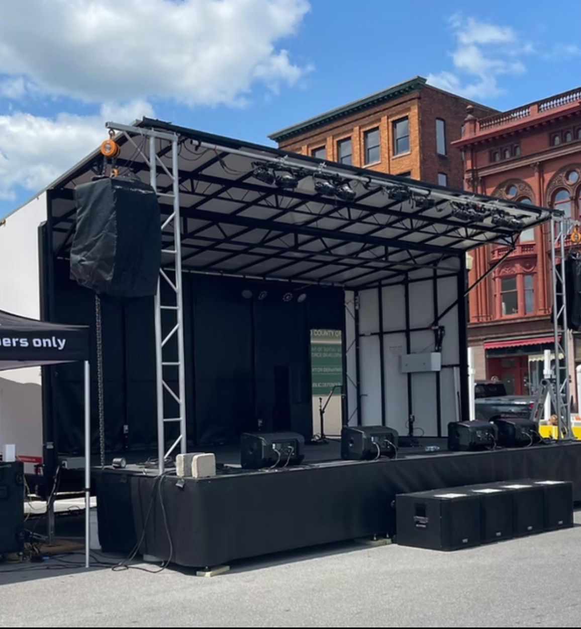 Full band mobile stage package setup on a city street