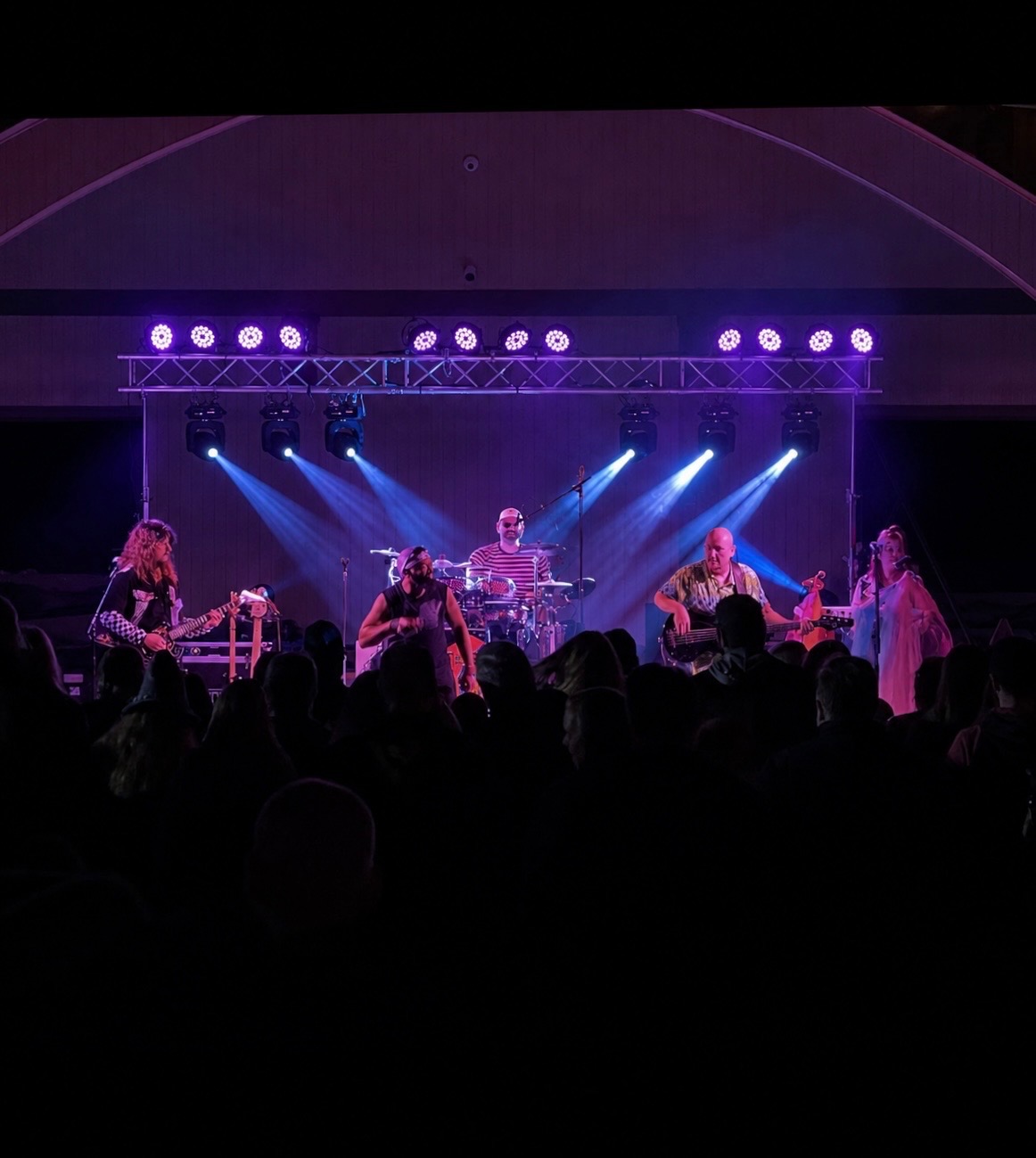 Live band on Nova Stage with purple and blue stage lighting